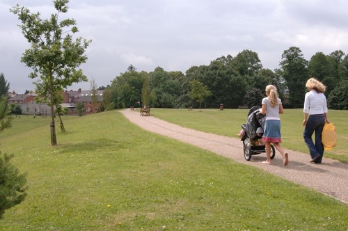 People walking town park in Wrexham